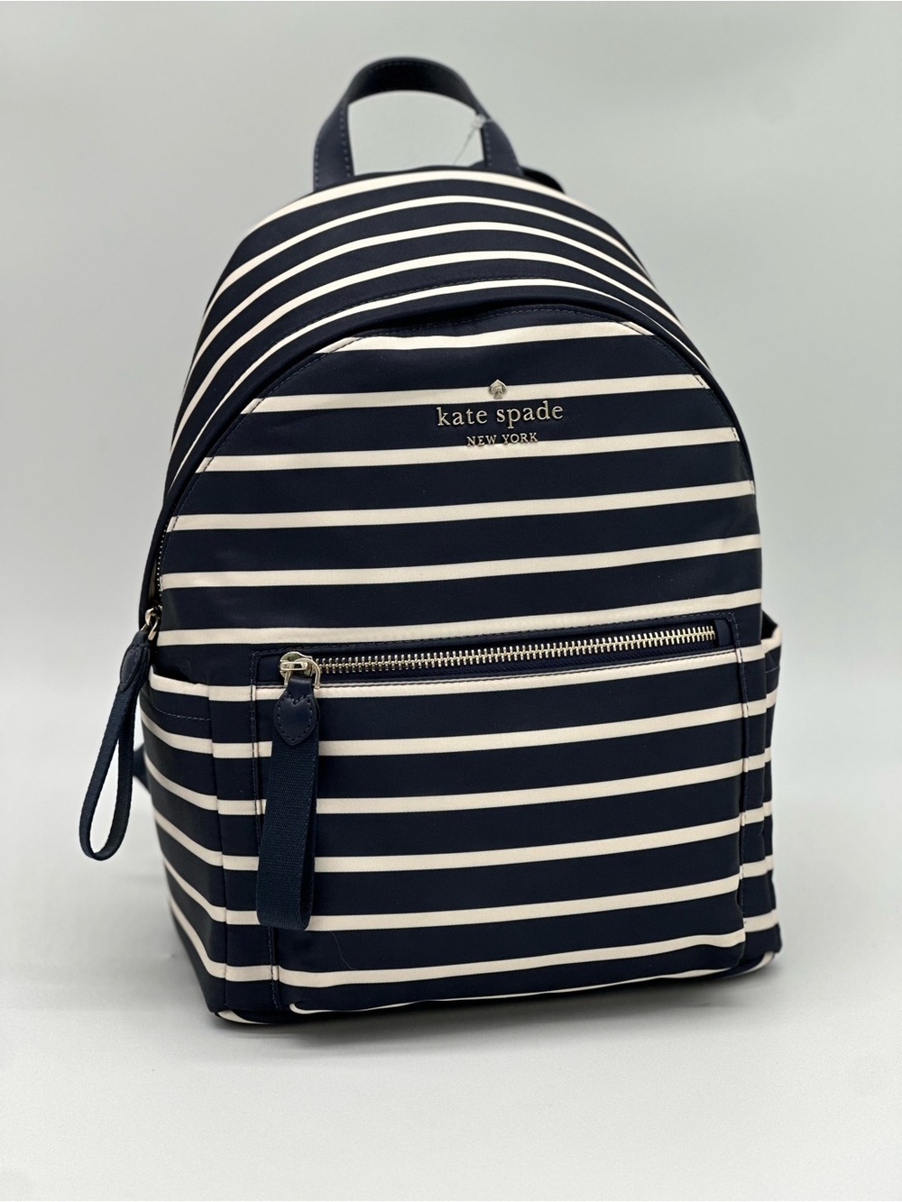 kate spade navy and white striped mini backpack with gold logo